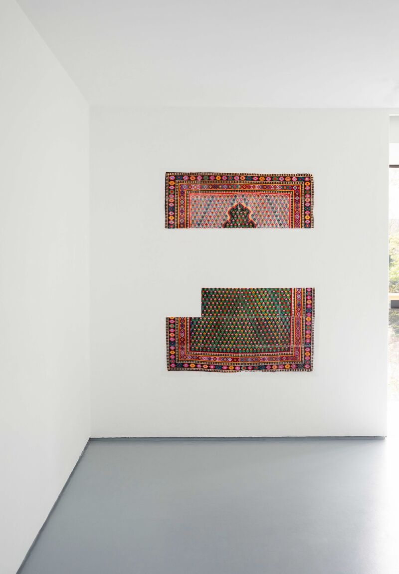 From Sukaina Kubba's exhibition in DCA - a colourful rug is cut into two parts.