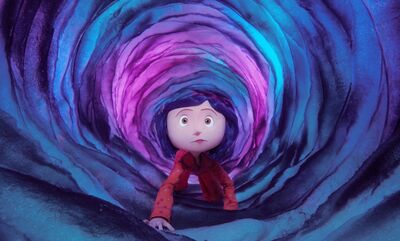 A film still from the stop-motion animated film Coraline shows Coraline, a young girl with dark hair, crawling through a large tunnel which is purple, pink and blue.