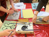 People creating gelli prints and painted artworks