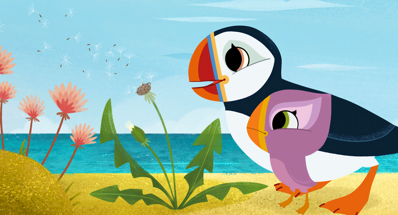 Animation still: two puffins stand on the beach looking at a dandelion on the beach