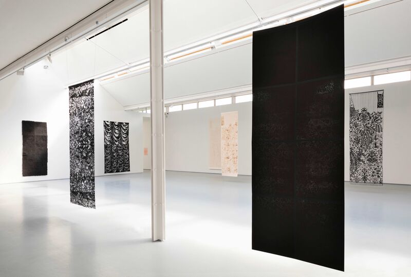 Tapestries by Sukaina Kubba hang in DCA Galleries. There is a black one, and intricate tapestries made with a black 3D pen.