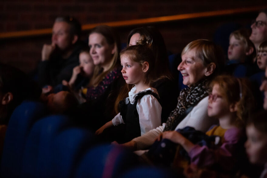 A little girl enjoys a film at DCA Cinema